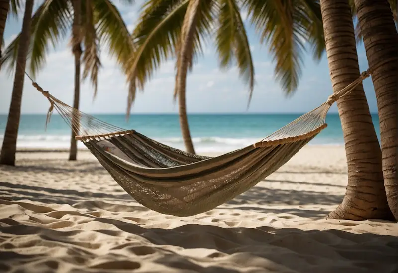 A serene beach with a hammock strung between two palm trees, a gentle breeze rustling through the leaves. A book, a sketchpad, and a pair of sunglasses rest on a nearby table